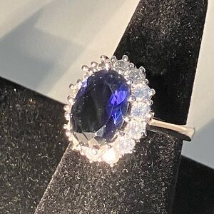 Elegant Diana ring in silvertone size 8. Precision cut cubic zirconias.